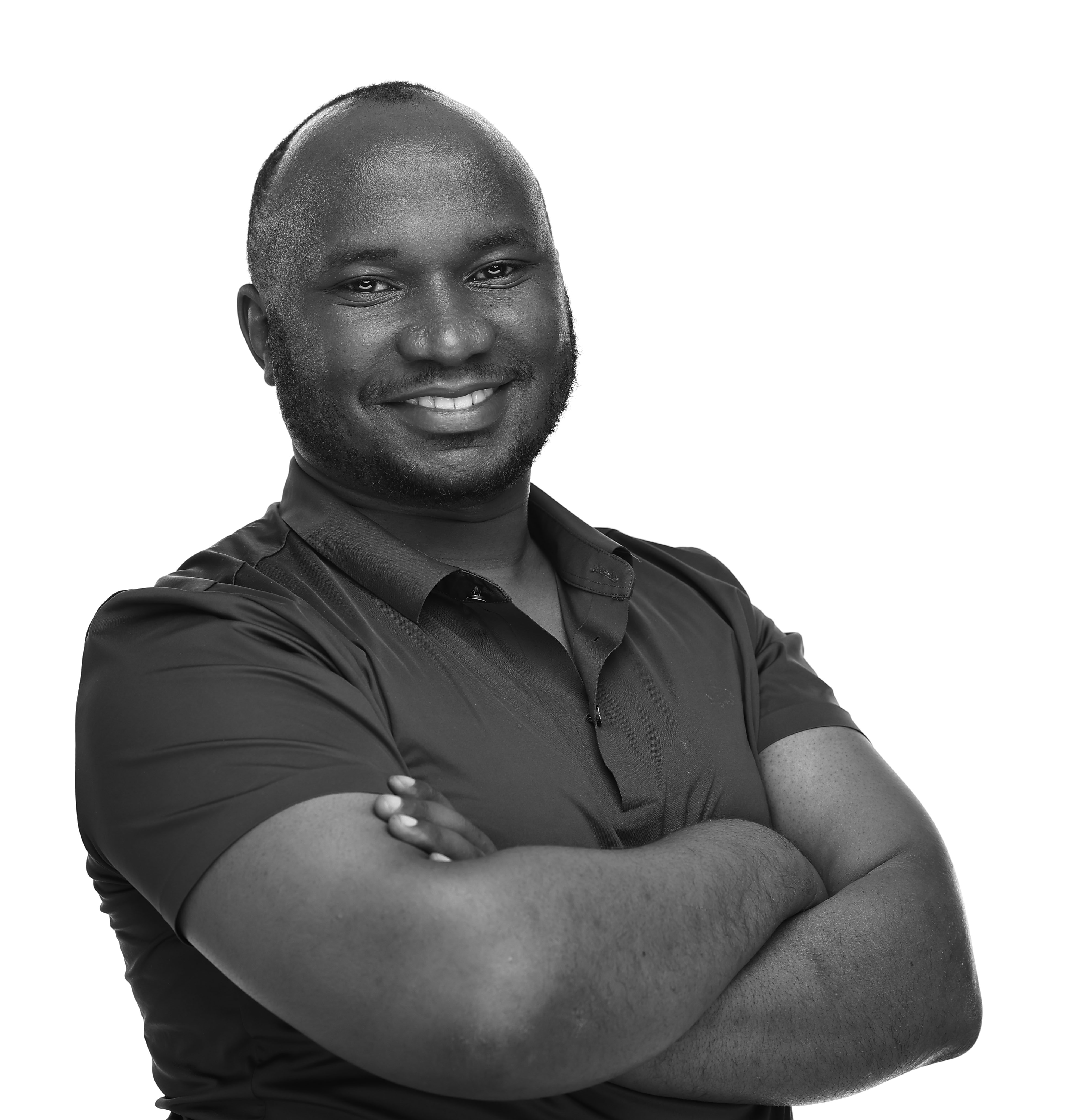 Abraham N. Taremwa, Marketing and Digital Strategy Professional, smiling with arms crossed in a professional black and white portrait.